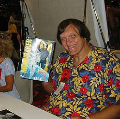 Richard Kiel holds a Mego Jaws